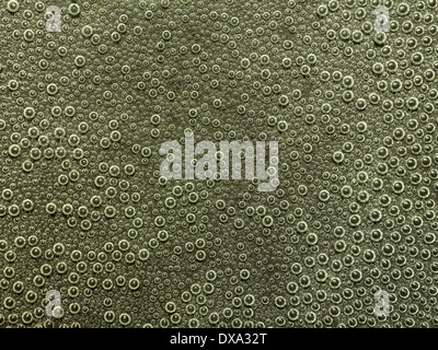 full frame abstract underwater background with lots of small air bubbles Stock Photo