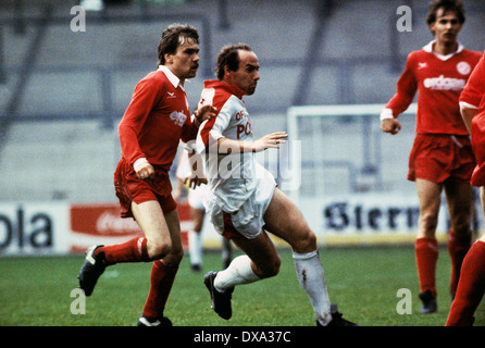 football, 2. Bundesliga, 1982/1983, Georg Melches Stadium, Rot Weiss Essen versus Kickers Offenbach 4:2, scene of the match, Karl-Heinz Gundersdorf (RWE) left and Gerd Paulus (Kickers) Stock Photo