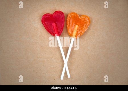 Couple of heart shape lollipops on a cardboard Stock Photo