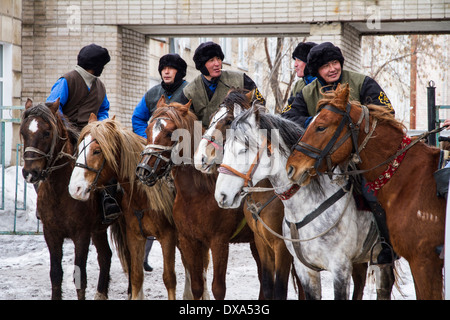Kazakhstan, Petropavlovsk - MARCH 21, 2014: Muslim new year celebration. Horsemen Stock Photo