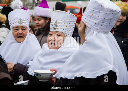 Kazakhstan,Petropavlovsk - MARCH 21, 2014: Muslim new year celebration.Three old women in national Kazakh costumes Stock Photo