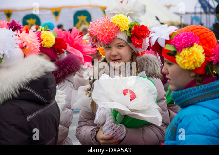 Kazakhstan,Petropavlovsk - MARCH 21, 2014: Muslim new year celebration. Little girls decorated with flowers Stock Photo
