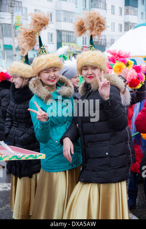 Kazakhstan,Petropavlovsk - MARCH 21, 2014: Muslim new year celebration. Two girls national costumes Stock Photo