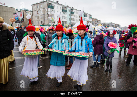Kazakhstan,Petropavlovsk - MARCH 21, 2014: Muslim new year celebration. Girls bear candy Stock Photo