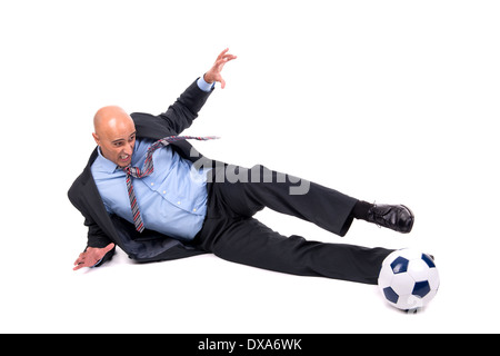 Businessman playing football isolated in white Stock Photo