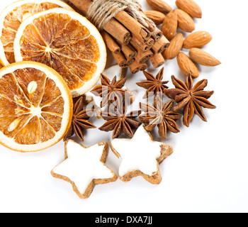 cinnamon sticks, anise stars and sliced of dried orange. christmas cookies Stock Photo
