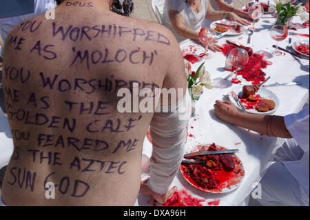 Activists from 269life animal rights movement take part in a visual protest whereby they draw their own blood to emphasize their ideology in Tel Aviv on 21 March 2014. 269life was founded to draw attention to the plight of animals raised and slaughtered for human consumption. Stock Photo