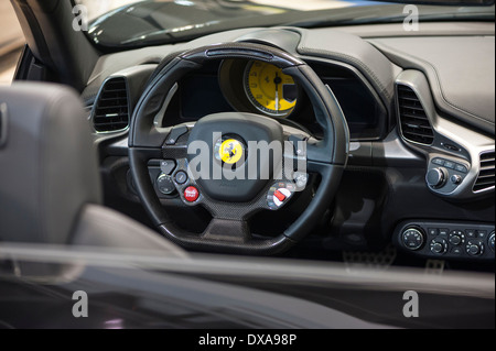 Hi-tech steering wheel of a Ferrari sportscar on display at the Zurich Motor Show, Switzerland's largest car exhibition. Stock Photo