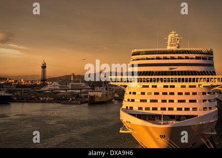 Sunset cruise ship docked in harbor, Barcelona, Spain Stock Photo