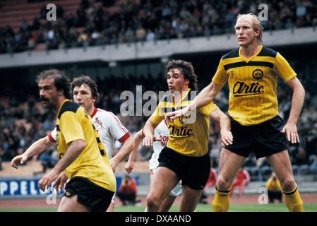 football, Bundesliga, 1983/1984, Muengersdorf Stadium, 1. FC Cologne versus Borussia Dortmund 5:2, scene of the match, f.l.t.r. Harald Konopka (BVB), Klaus Fischer (FCK), Meinolf Koch (BVB), Rolf Ruessmann (BVB) Stock Photo