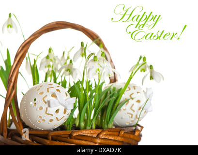 Happy Easter! card concept. easter eggs and spring flowers snowdrops on white background Stock Photo