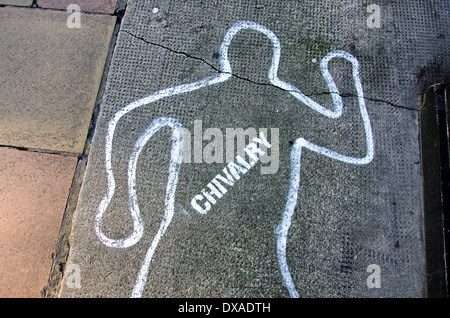 Chivalry is dead - the outline of a body and the word 'chivalry' drawn on the pavement. Stock Photo
