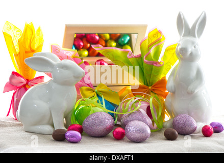 easter decoration. assorted eggs and bunnies on white background Stock Photo