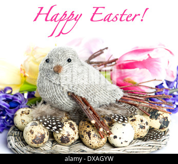 Happy Easter! card design. easter decoration with spring flowers. bird with eggs and feathers Stock Photo