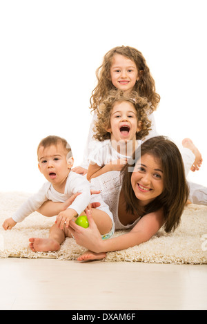 Mother and their three kids having fun home Stock Photo