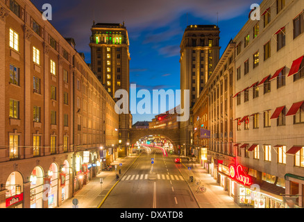 Evening view of Kungsgatan, a main street in central Stockholm.  It is flanked by 2 tower buildings, Kungstorn ('King's Towers') Stock Photo