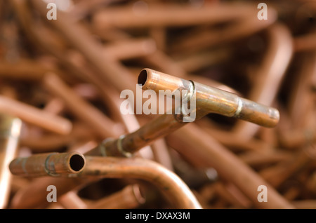 mass of copper plumbing pipe discarded and now scrap metal 15 20 mm tubing soldered junction lead free Stock Photo