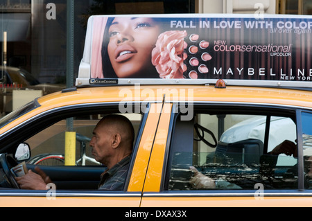A driver passing by Gramercy. Gramercy is a highly respectable neighborhood with a large number of historic buildings. Taxi cab Stock Photo
