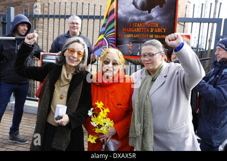 Dublin, Ireland. 22nd March 2014. Margaretta D'Arcy poses with supporters for the press. The 79 year old Irish peace activist and actor Margaretta D'Arcy has been released from Mountjoy prison in Dublin. She served a three month long sentence for refusing to sign a bond to keep away from unauthorised zones at Shannon airport. Credit:  Michael Debets/Alamy Live News Stock Photo