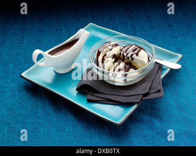 Chocolate agave vanilla ice cream scoops topping Stock Photo