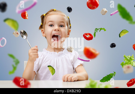 mother and daughter prepare salads Stock Photo