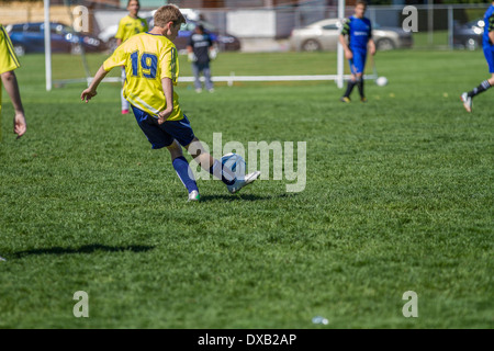 HIgh school boys playing soccer, outdoors. Stock Photo