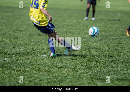 HIgh school boys playing soccer, outdoors. Stock Photo