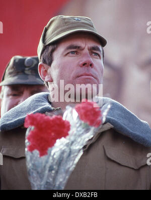 Feb. 16, 1989 - Termez, Uzbekistan, RU - Holding flowers given to him by locals, a Soviet soldier of the 103rd Guards Airborne Division, 40th Army, one of the last Soviet soldiers to leave Afghanistan, at a ceremony in the border town of Termez in the Uzbek Soviet Socialist Republic, shortly after crossing the 'Friendship Bridge' over the Amu Darya river linking the Afghan border town of Hayratan with Termez, in the Uzbek Soviet Socialist Republic. It was nine years and 50 days after intervening to support a coup by a Marxist ally. (Credit Image: © Arnold Drapkin/ZUMAPRESS.com) Stock Photo