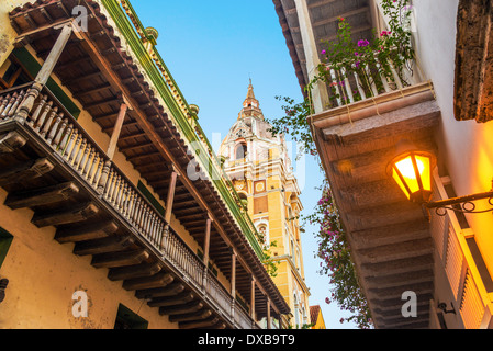 View looking up at historic colonial balconies and a church in Cartagena, Colombia Stock Photo