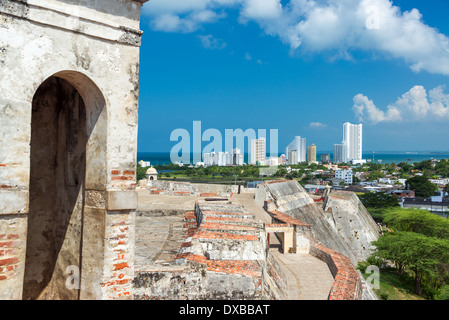 San Felipe de Barajas castle in Cartagena, Colombia with modern high rise apartment buildings visible in the background Stock Photo