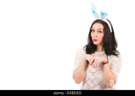 Funny woman with bunny ears gesticulate isolated on white background,copy space for text message in left part of image Stock Photo