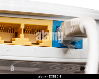 Router network hub with patch cable on isolated background Stock Photo