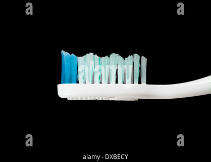 Toothbrush on the isolated black background Stock Photo
