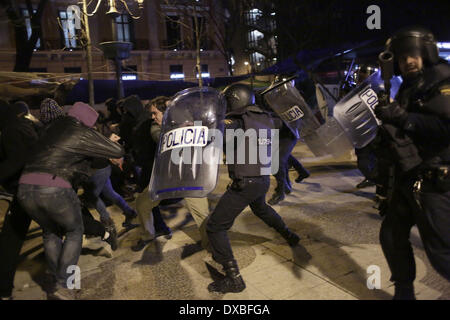 Madrid, Spain. 22nd Mar, 2014. Protestors clash with police during a protest called ''march for dignity'' against the government in Madrid, Spain, Saturday, March 22, 2014. Spanish police and protesters clashed at the end during an anti-austerity demonstration that drew tens of thousands of people to central Madrid on Saturday. Police said in a statement more than 100 people were injured 55 officers some of them with severe wounds and 29 people were arrested. Credit:  Rodrigo Garcia/NurPhoto/ZUMAPRESS.com/Alamy Live News Stock Photo