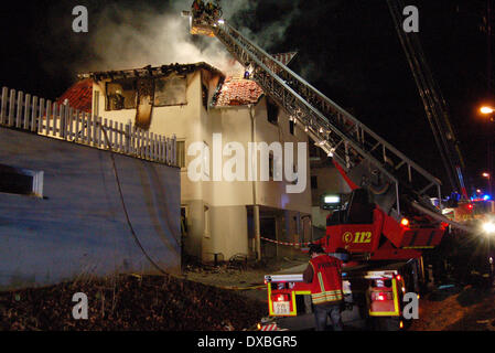 Rottweil, Germany. 23rd Mar, 2014. Smoke rises from a burnt out attic of a house in Rottweil, Germany, 23 March 2014. According to police reports two teenagers died in the fire. Photo: KAMERA 24/dpa/Alamy Live News Stock Photo