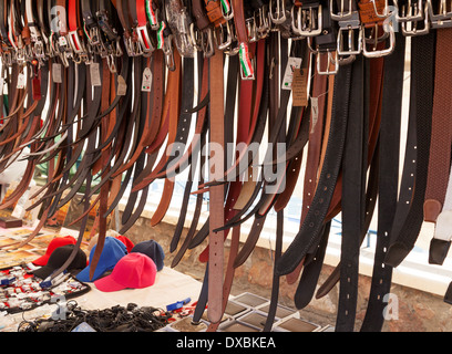 Leather belts for sale in Villaricos village market, Almeria Andalusia, Spain Europe Stock Photo