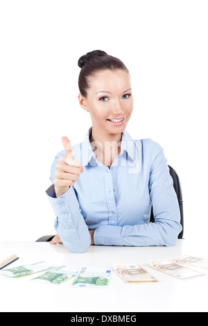 Smilling businesswoman on workplace doing gesture thumbs up Stock Photo