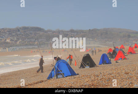 Seaford, East Sussex, UK. 23 March 2014. A bright blustery day with occasional stormy showers at the National Flat Fish fishing competition. David Burr/Alamy Live News Stock Photo