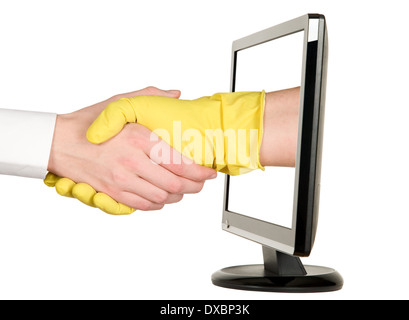 Industry worker with glove shakes hands with businessman on lcd monitor Stock Photo