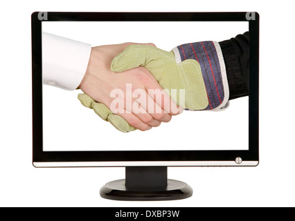 Industry worker with glove shakes hands with businessman on lcd monitor Stock Photo