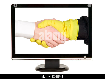 Industry worker with glove shakes hands with businessman on lcd monitor Stock Photo