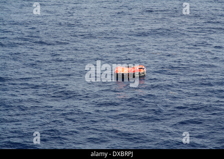 An Isolated Life raft adrift in mid Ocean Stock Photo - Alamy