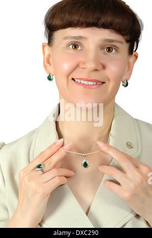 Happy woman holding fingers emerald pendant with chain Stock Photo