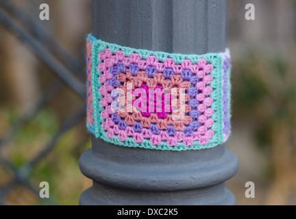 Yarn bombing, knitted sleeve around a lamppost in Fuengirola, Spain Stock Photo