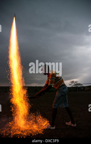 Man lighting fireworks Stock Photo