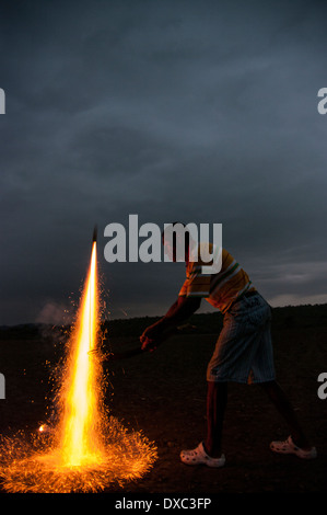 Man lighting fireworks Stock Photo