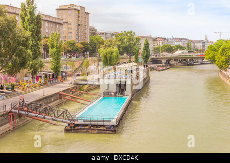 outdoor pool installed on two barges on the danube canal close to the aspern bridge housing also a restaurant and a music club Stock Photo