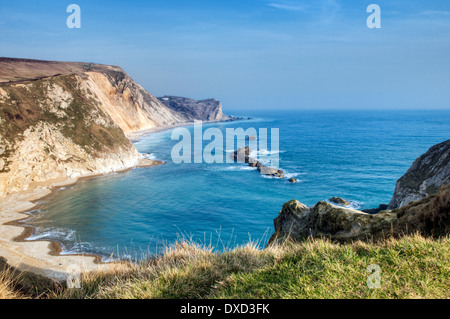 Old man of war at Durdle Door on the Jurassic Coast near Lulworth in Dorset, England taken on fine spring day. Stock Photo