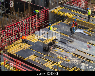 Construction site work in a city centre, construction workers working Stock Photo