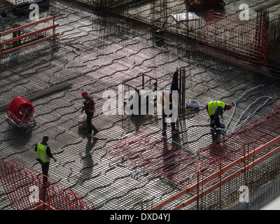 Construction site workers on a city centre building site Stock Photo